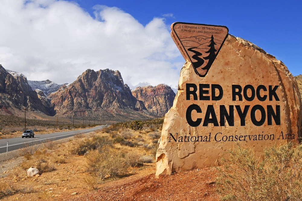 a sign on the side of a mountain