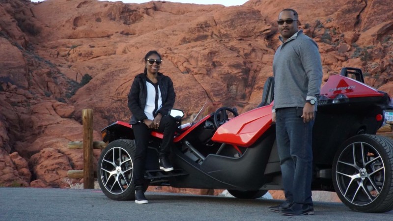 a man riding a motorcycle on the side of a mountain